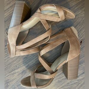 Brown faux leather strappy heels.